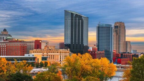 Grand Rapids, Michigan, in the fall with trees and skyscrapers.