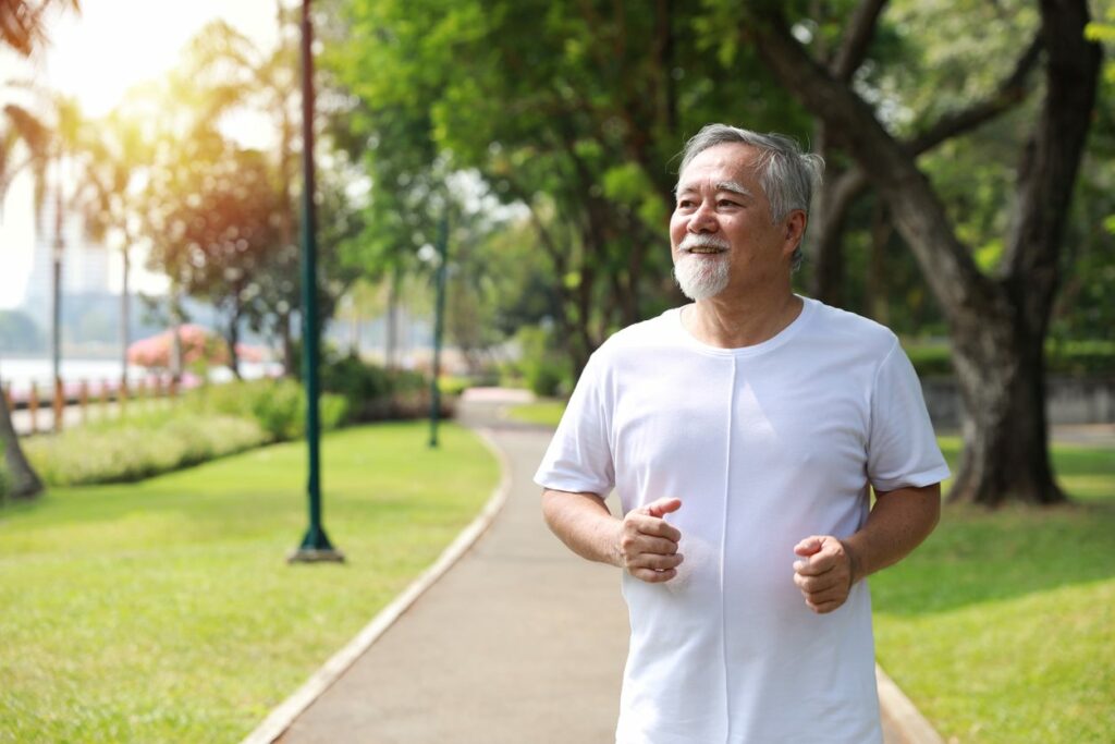 A pleasant looking man seen walking on a trail.
